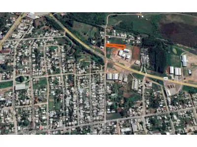 LOTE 001 - Terreno com a área de 1.410,82m², onde faz frente para a rua Ariano Aquino Pinto, distando 45m da área de domínio da BR 287. Matriculado sob n°53.760 do CRI de Santiago/RS.