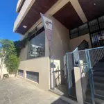 SALA COMERCIAL Nº 01, NO EDIFÍCIO TÍVOLI EM SANTA MARIA/RS, COM UMA ÁREA PRIVATIVA DE 138,040 M² E O BOX GARAGEM Nº 08, LOCALIZADO NO SEGUNDO SUBSOLO OU PRIMEIRO PAVIMENTO DO EDIFÍCIO TÍVOLI, AMBOS SITUADOS  À RUA FLORIANO PEIXOTO, Nº 611 EM SANTA MARIA/RS. MATRICULADOS SOB Nº 85.105 E 85.098 DO CRI DE SANTA MARIA/RS.