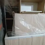 MÓVEIS PLANEJADOS DE COZINHA NOVOS, AOS QUAIS ENCONTRAM-SE DESMONTADOS, 100% (CEM POR CENTO) MDF 18MM, CORPO EM MDF BRANCO E EXTERNO EM AMADEIRADO, MEDIDAS CONFORME PROJETO EM ANEXO E NA FOTO.